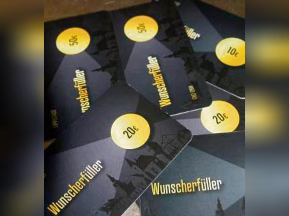 Ein Stück Heimat: Der Wunscherfüller, digitalisiert oder wie hier im Scheckkartenformat, ist in ca. 90 Geschäften einlösbar. Foto: Schwade