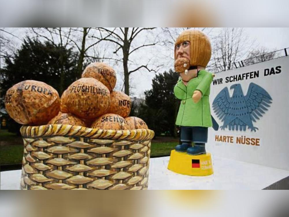Harte Nüsse: Nach Angela Merkels „Wir schaffen das“-Äußerung nahmen im Folgejahr auch die Karnevalisten das Motto auf. Foto: Oliver Berg (dpa)