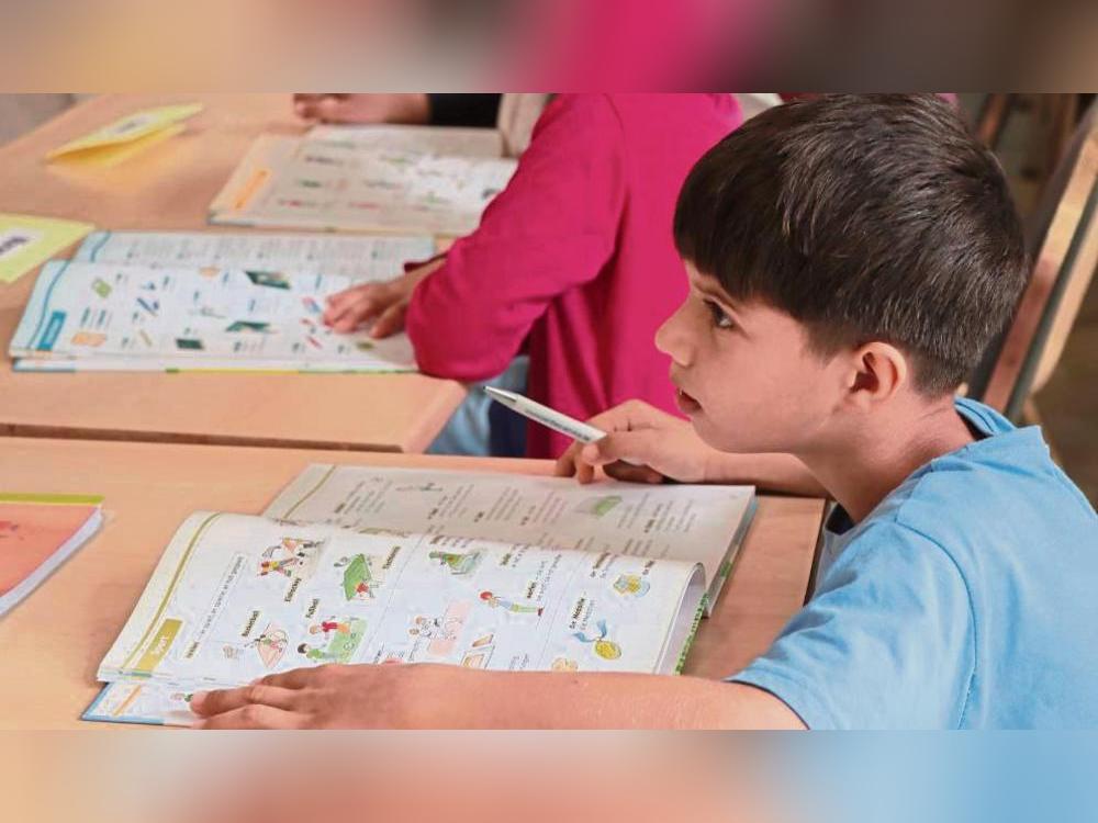 Zu den Angeboten der Erwitter Flüchtlingshilfe zählt unter anderem die Sommerschule, bei der Kinder von Migranten Nachhilfe – und zwar nicht nur in Deutsch – bekommen. Archivfoto: Ulrike Dietz