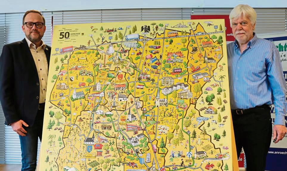Bürgermeister Alfred Schmidt und Illustrator Gerd Korge mit dem Anröchter Wimmelbild.