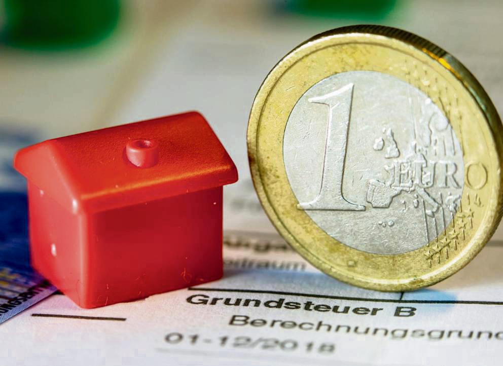 Unterschiedliche Hebesätze für Wohnen und Gewerbe sind rechtswidrig – sagt das Verwaltungsgericht. Für Hausbesitzer in Lippstadt kann das Urteil teure Folgen haben. Foto: DPA